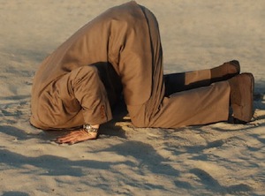 man with head in the sand