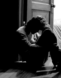 depressed person sitting on the floor