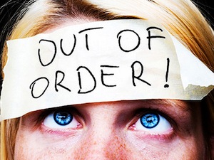 woman with out-of-order sign on forehead