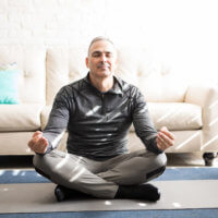 Men need estrogen too. Taking time to meditate, like this man is doing, can help manage stress and keep estrogen levels in check.