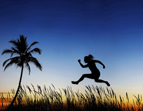 Woman jumping in field
