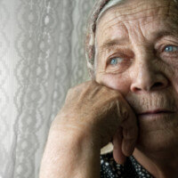 Sad lonely pensive old senior woman