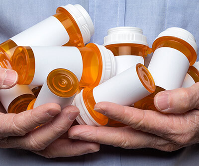 Hands holding subscription bottles